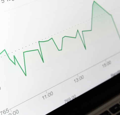 Price chart on a laptop screen